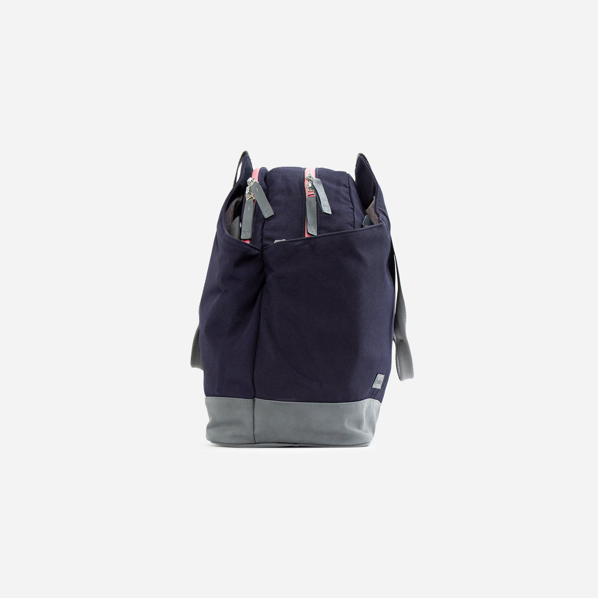 Navy and gray tennis  backpack on a light gray background