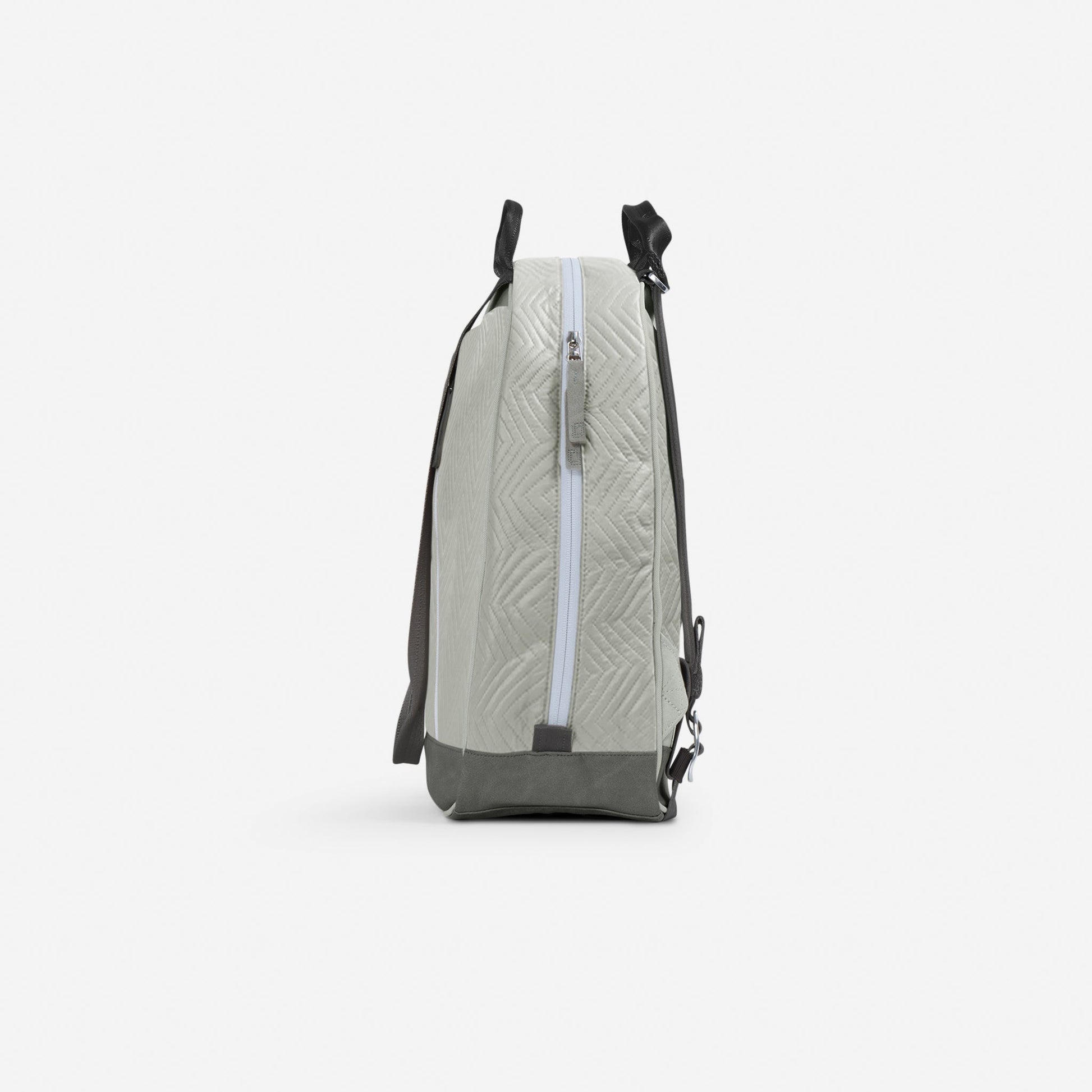 Light gray Doubletake tennis backpack with black straps on a white background