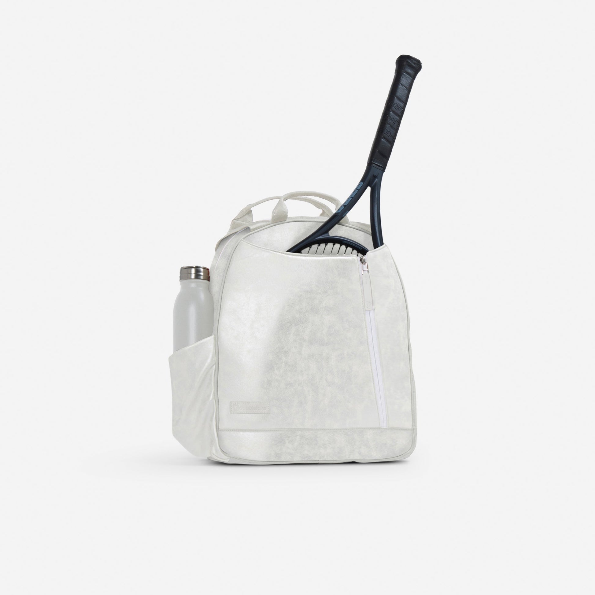White Doubletake tennis backpack with a tennis racket and water bottle on a white background
