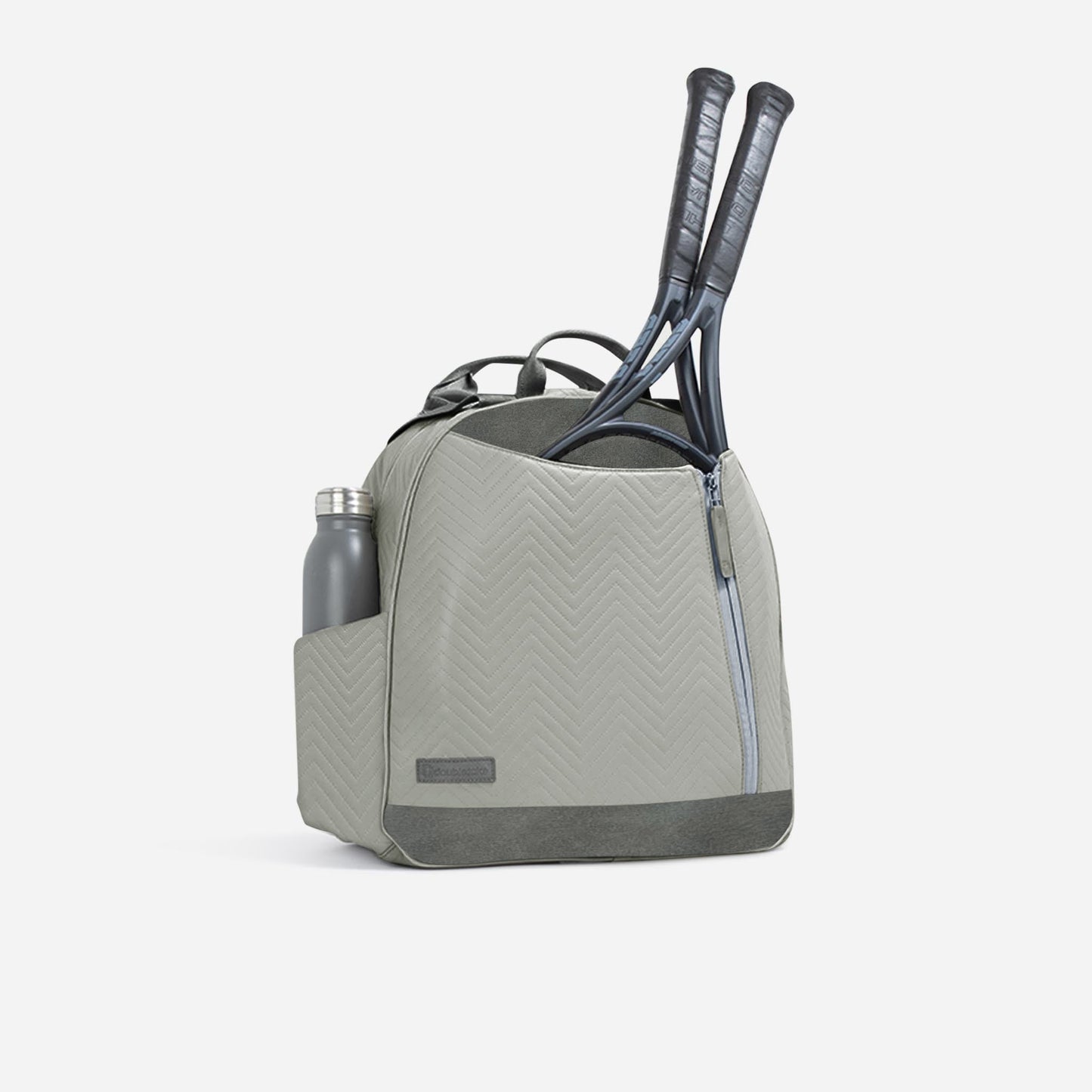 Gray Doubletake tennis bag with tennis rackets and a water bottle on a white background