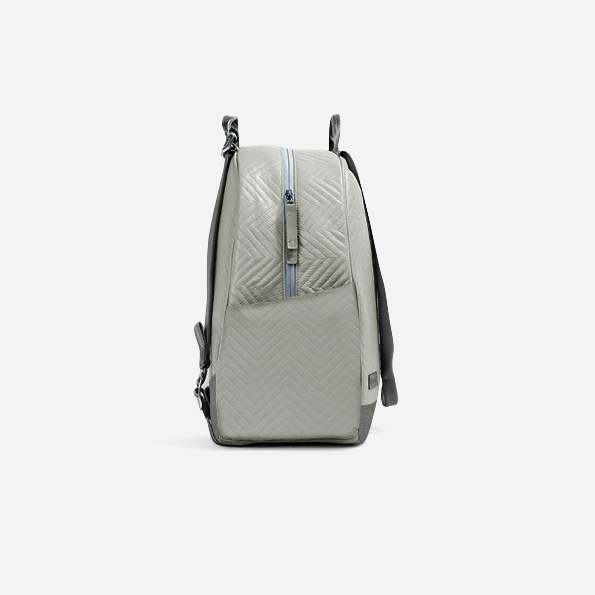 Light gray  Doubletake tennis backpack with quilted pattern on a white background