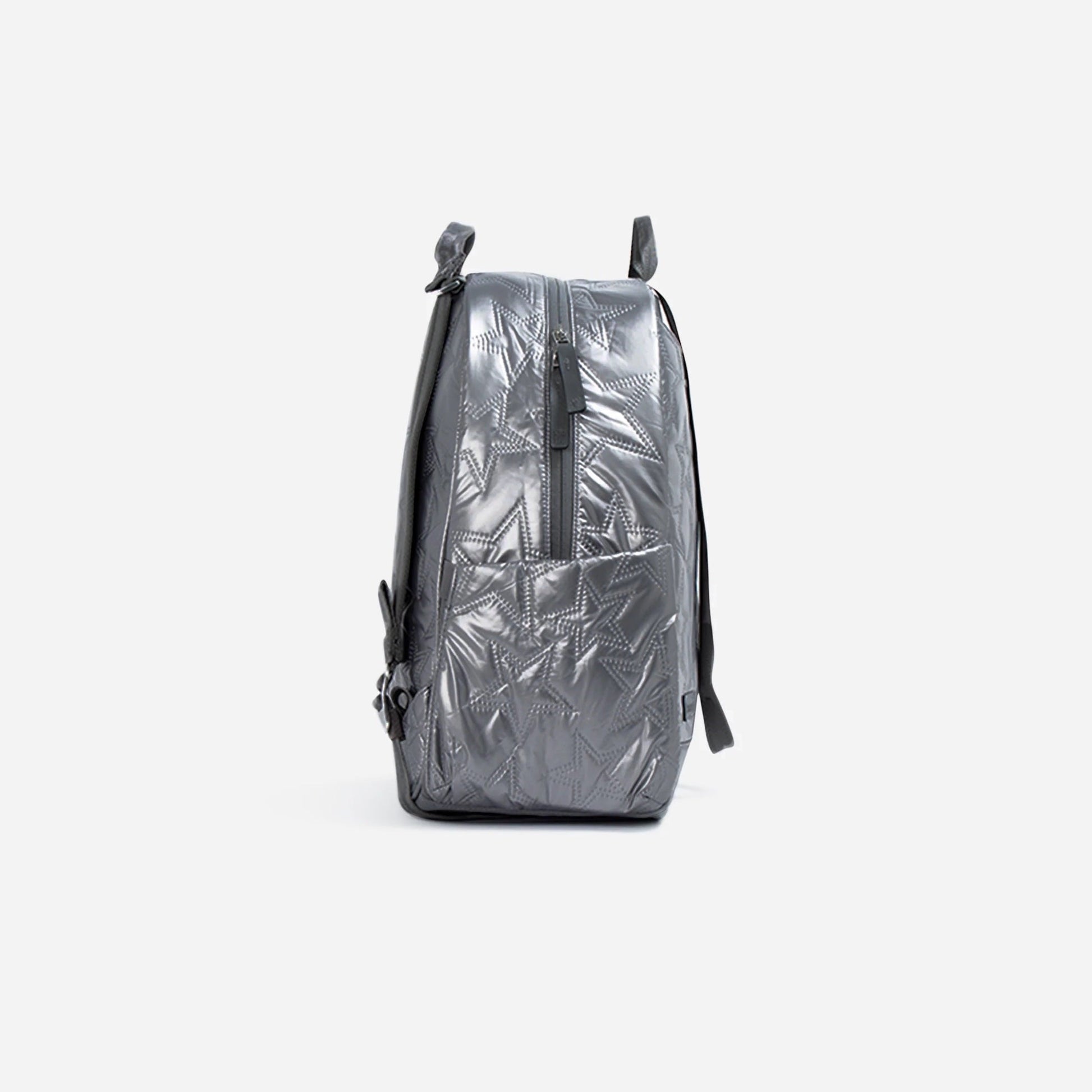 Silver metallic backpack on a light gray background