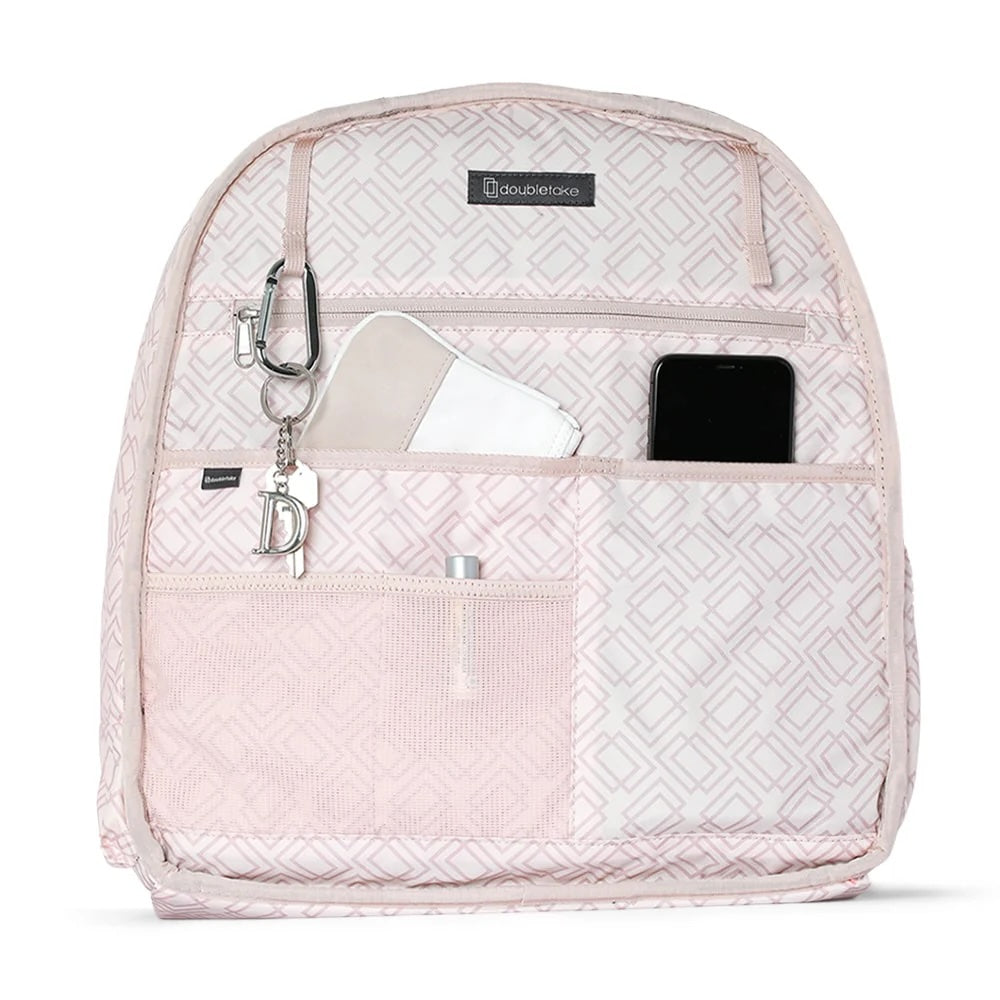 Pink  Doubletake tennis quilted backpack with multiple pockets on a white background