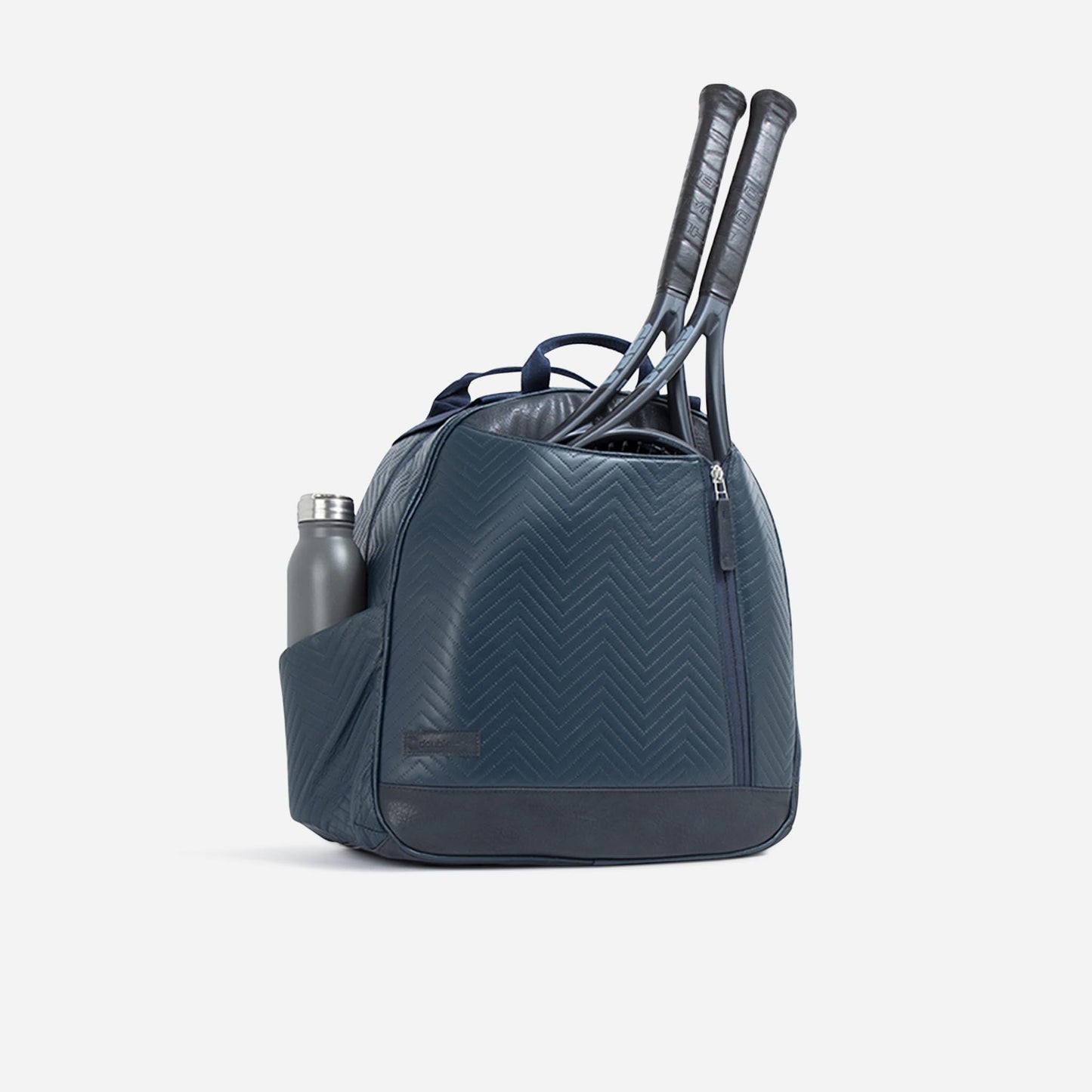Blue tennis  Doubletake tennis bag with two rackets and a water bottle on a light gray background