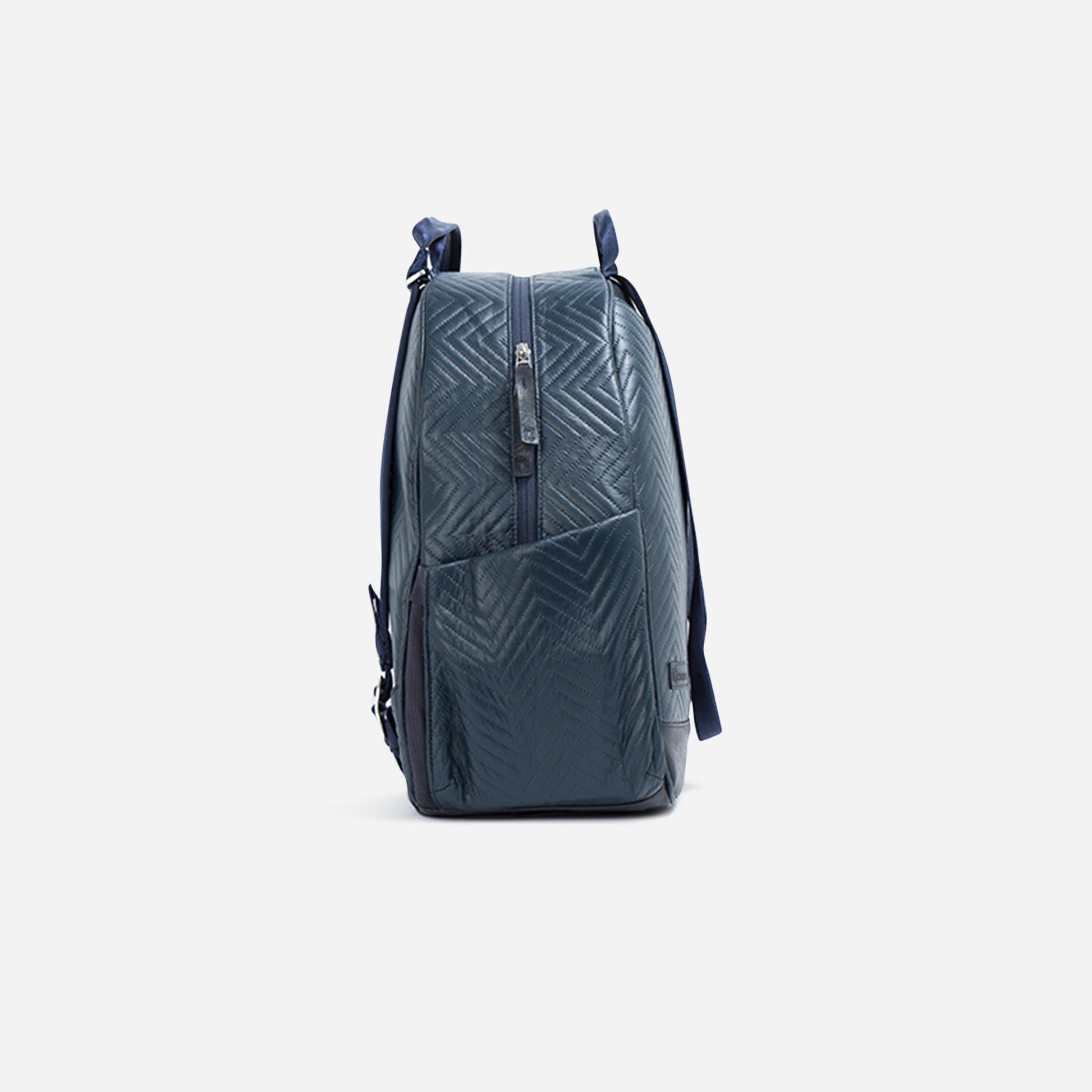 Blue  Doubletake tennis backpack with a geometric pattern on a light gray background