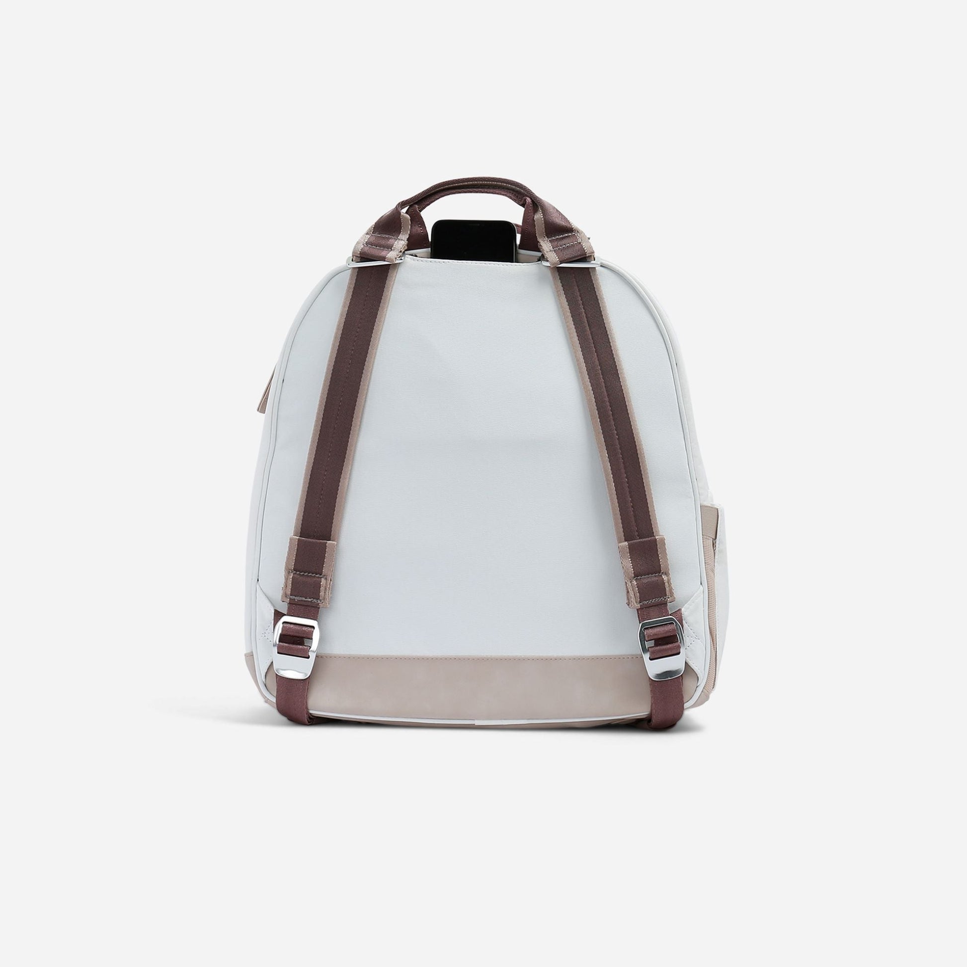 White  Doubletake tennis backpack with brown straps on a light gray background