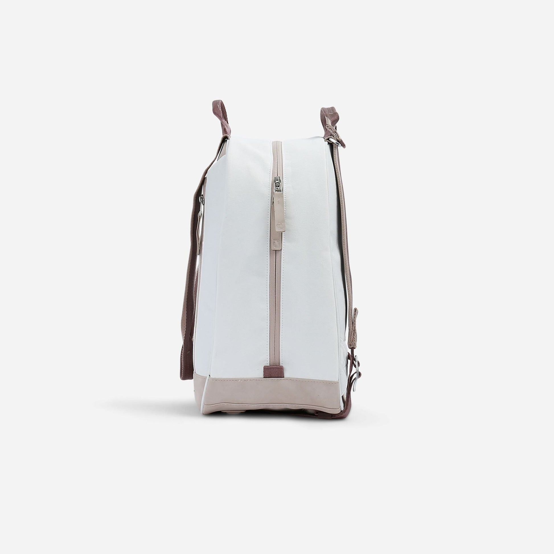 White  Doubletake tennis backpack with brown accents on a light gray background