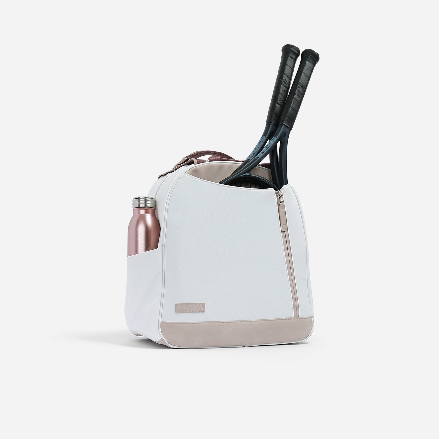 White sports  Doubletake tennis bag with a water bottle and tennis rackets on a light gray background