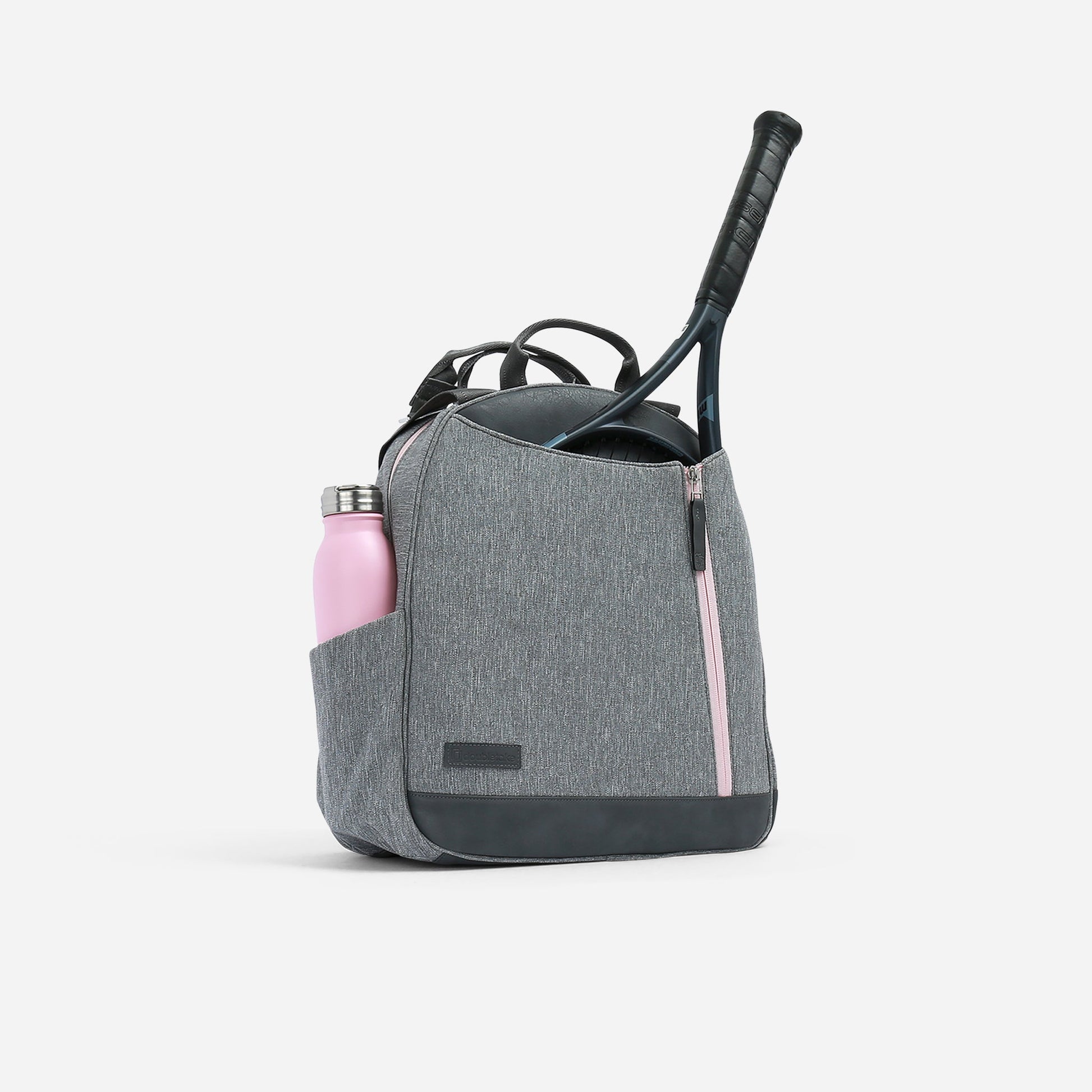 Gray  Doubletake tennis  backpack with a pink water bottle and black tennis racket on a white background