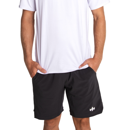 Person wearing black shorts with a logo on a white background