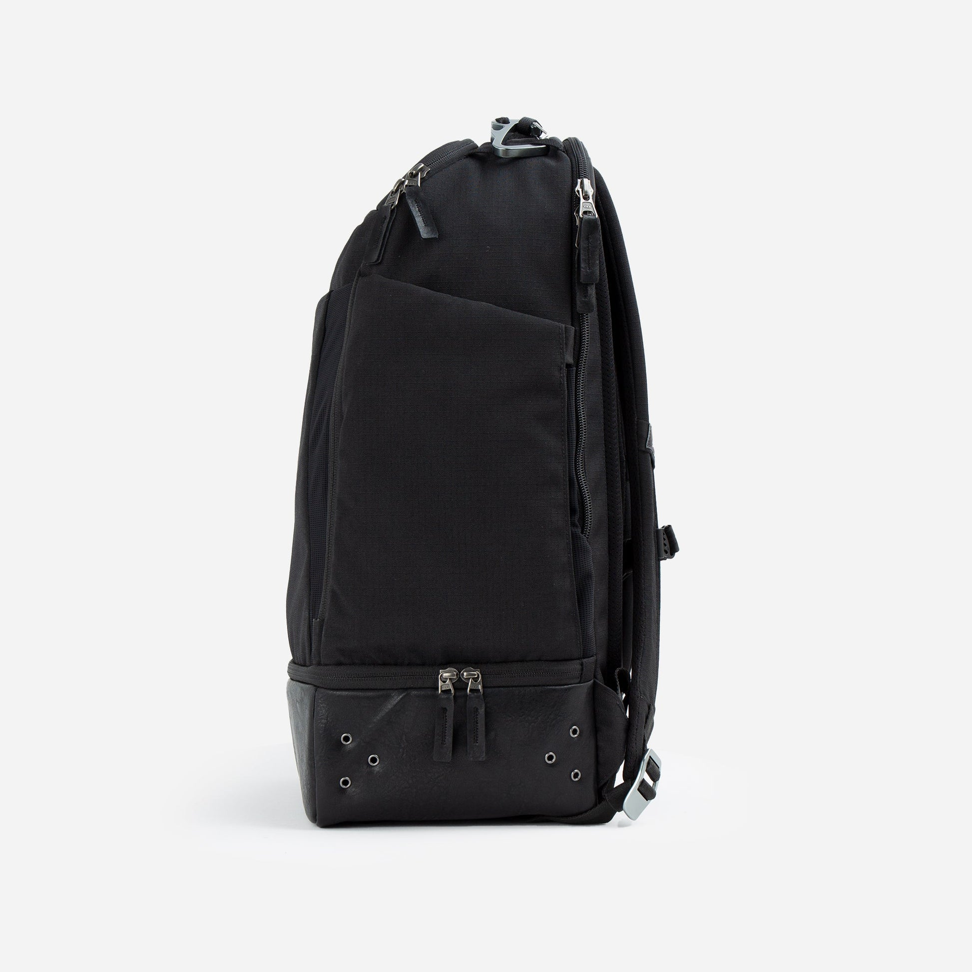 Black Doubletake tennis backpack on a light gray background