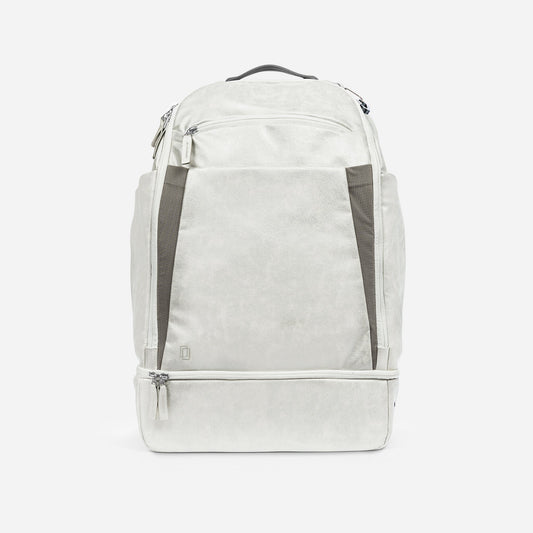 Light gray Doubletake tennis backpack with dark gray accents on a white background