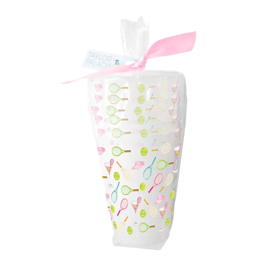 Clear plastic cups with tennis motif around it .