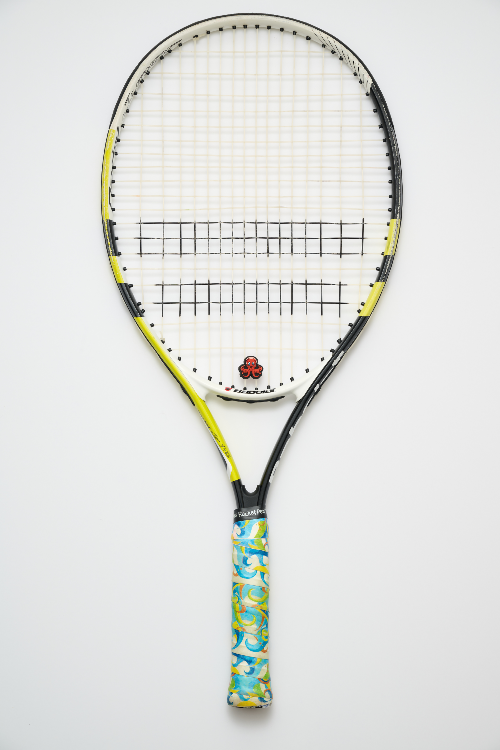 Tennis racket with a colorful handle on a white background