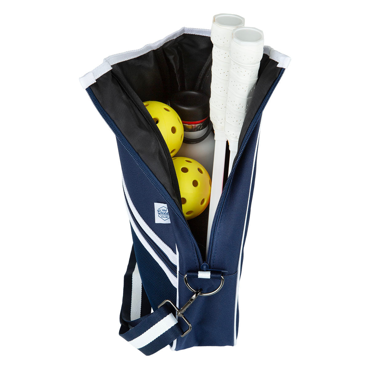 Navy blue pickleball bag with yellow balls, white paddles, and a bottle inside on a white background