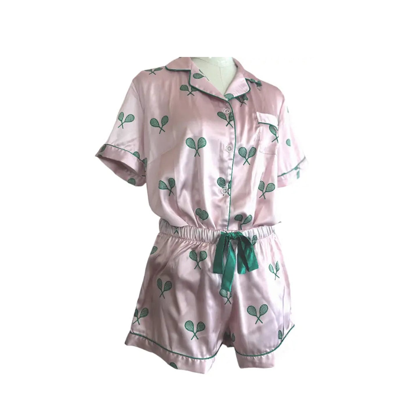 Pink satin pajamas with green tennis racquets on Tennis DuJour.