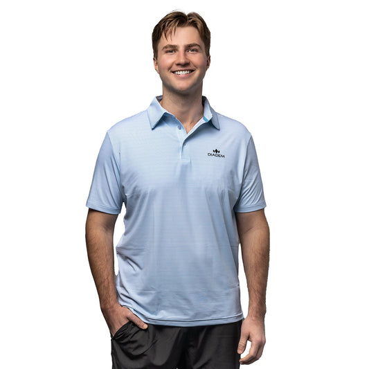 Man wearing a light blue polo shirt with a brand logo on a white background