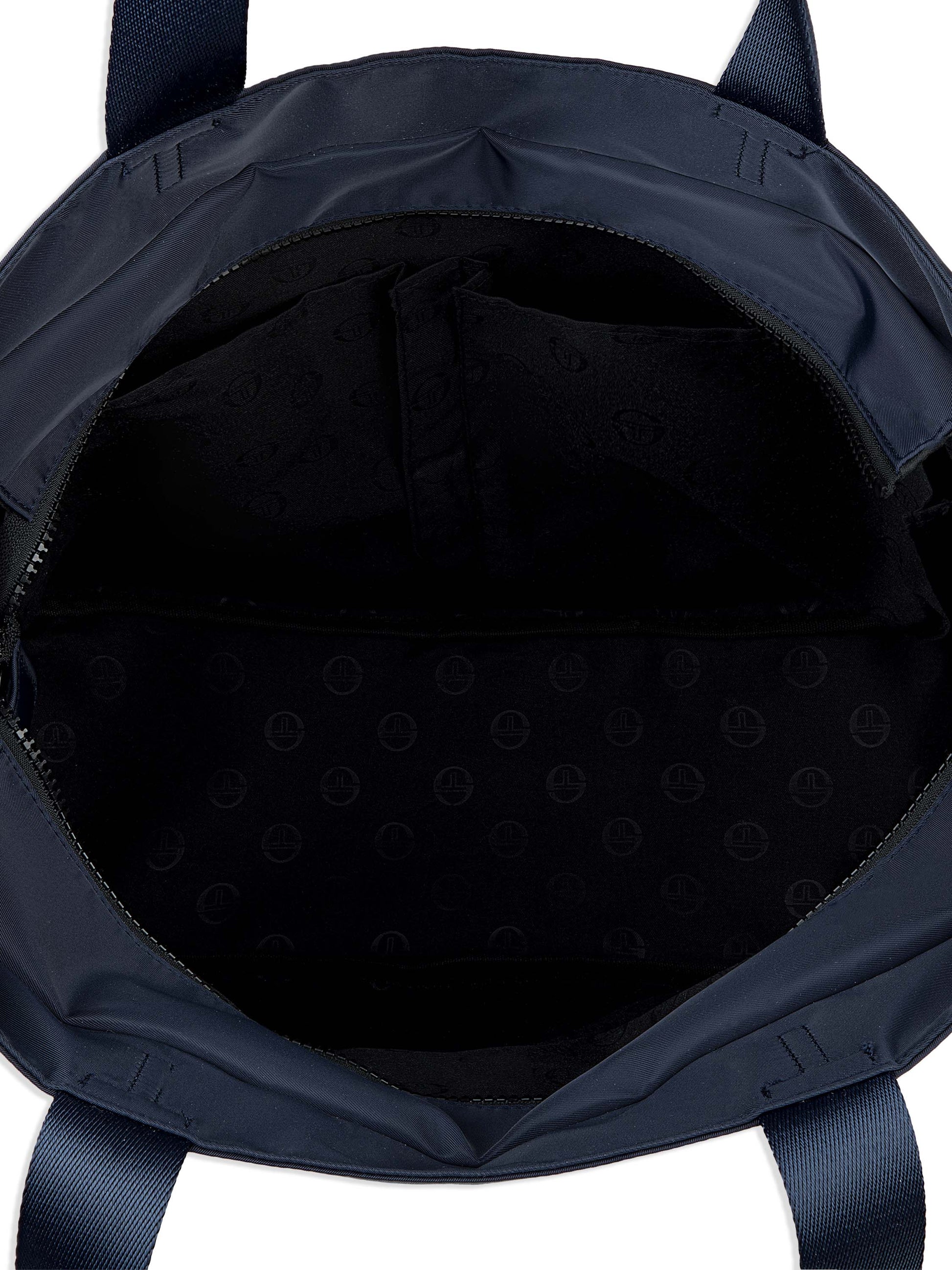 Navy blue backpack interior with a textured lining on a white background