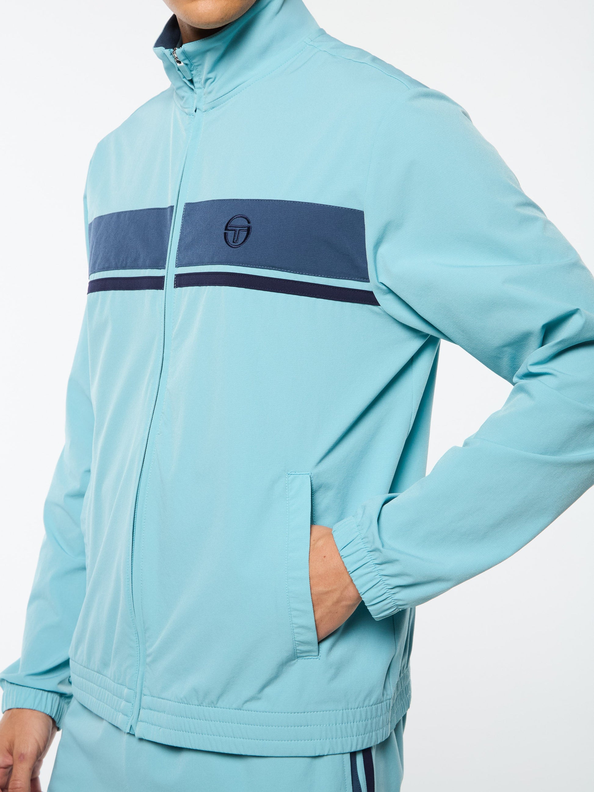 Light blue tracksuit with a brand logo on a white background