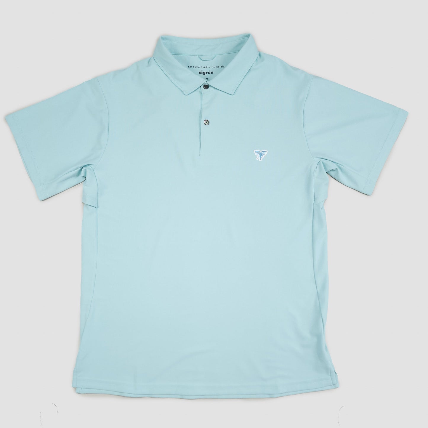 Light blue polo shirt with a small logo on a light gray background