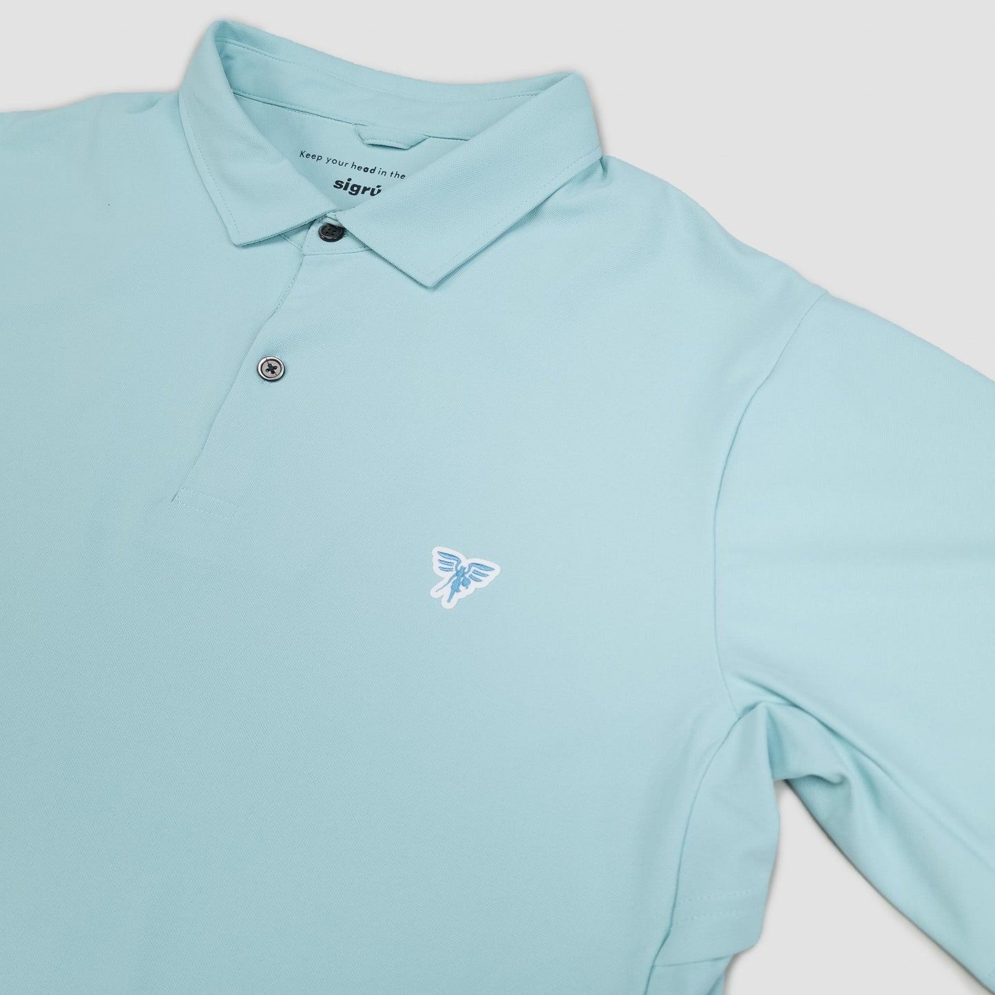 Light blue polo shirt with a small logo on a light gray background