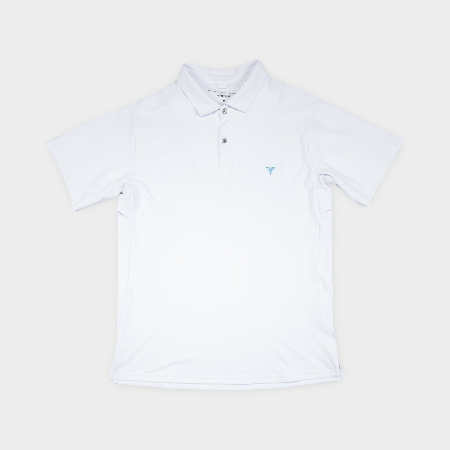 White polo shirt on a light beige background