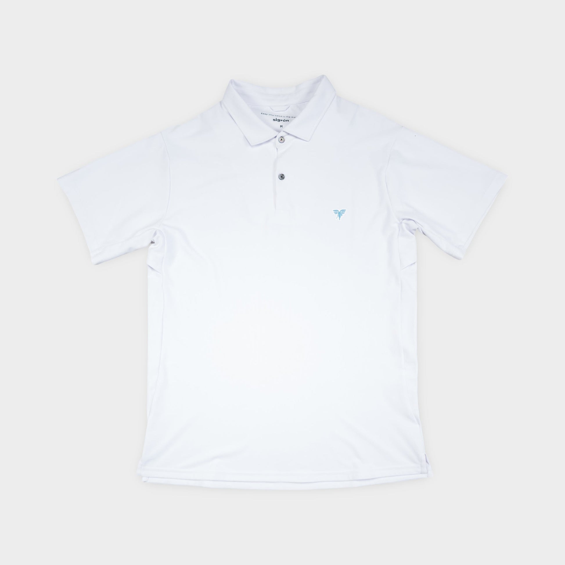 White polo shirt on a light beige background
