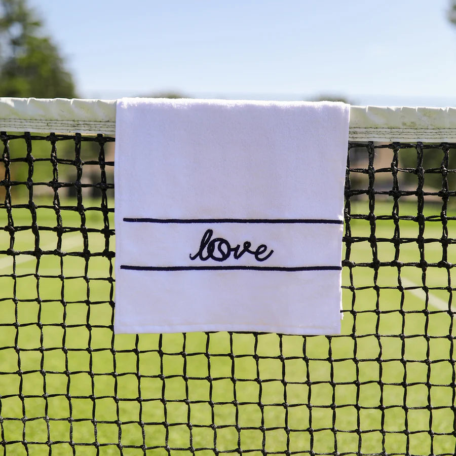 Ame & Lulu white tennis towel with "love" in navy blue on Tennis DuJour.com