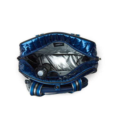 Inside the THINK ROYLN Champion Tennis bag in patent blue on TennisDuJour.com
