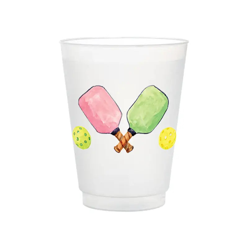 White cup with pickleball design featuring two paddles and balls on a white background