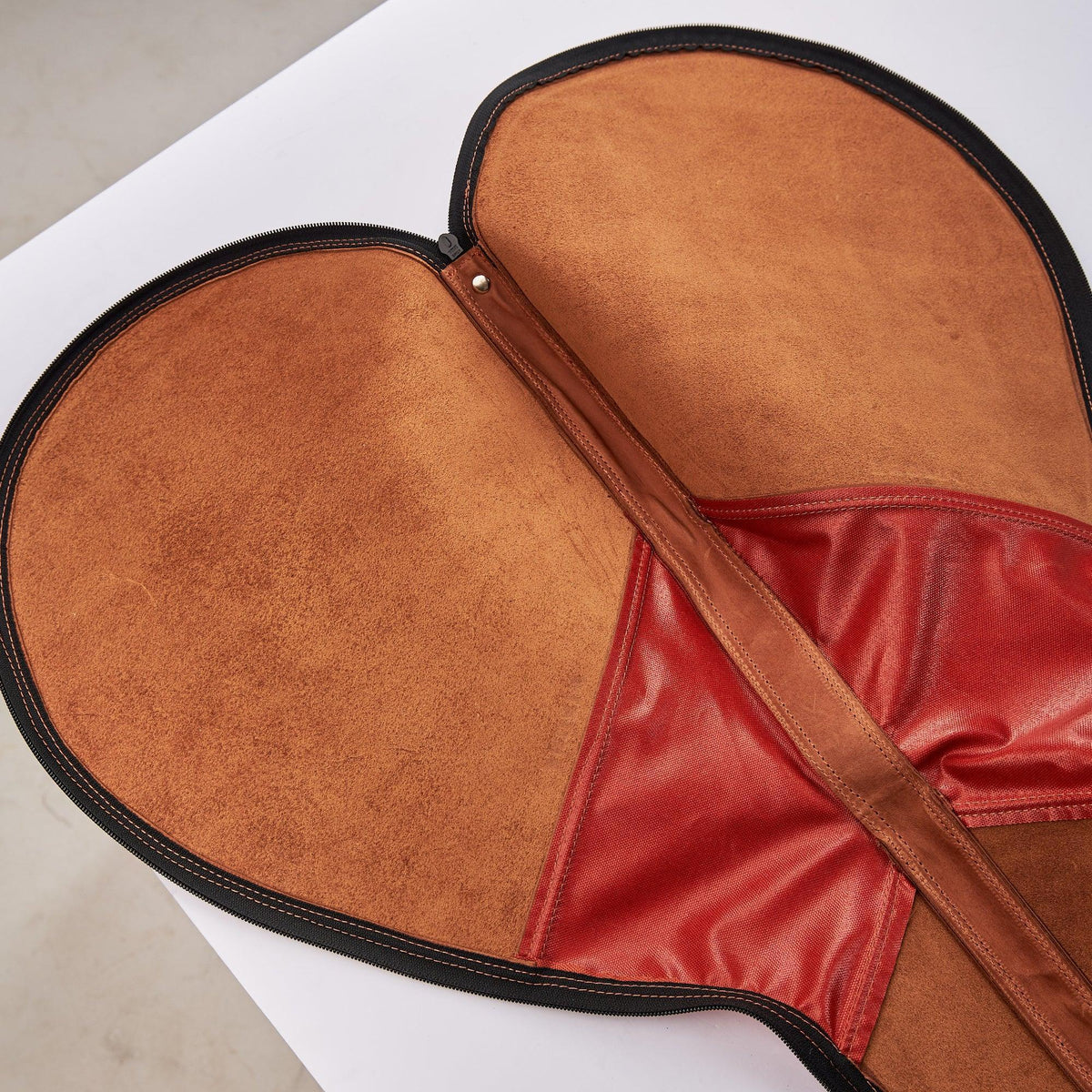 Inside of leather tennis racquet bag.