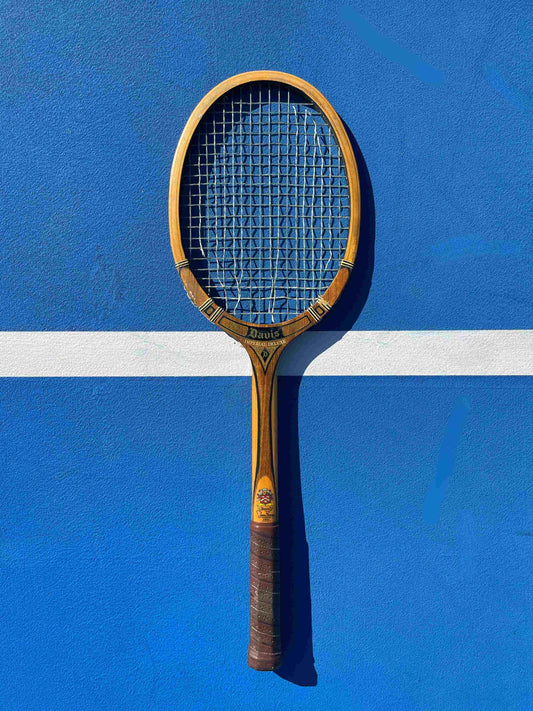 Vintage Tad Davis Imperial tennis racket on a blue tennis court