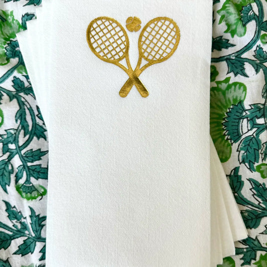 Cream linen guest napkins with gold tennis ball and racquets on Tennis DuJour.