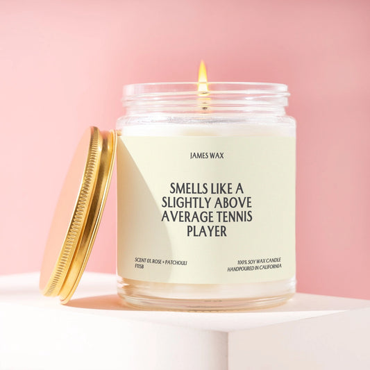 Burning candle with "smells like above average tennis player" on label. 