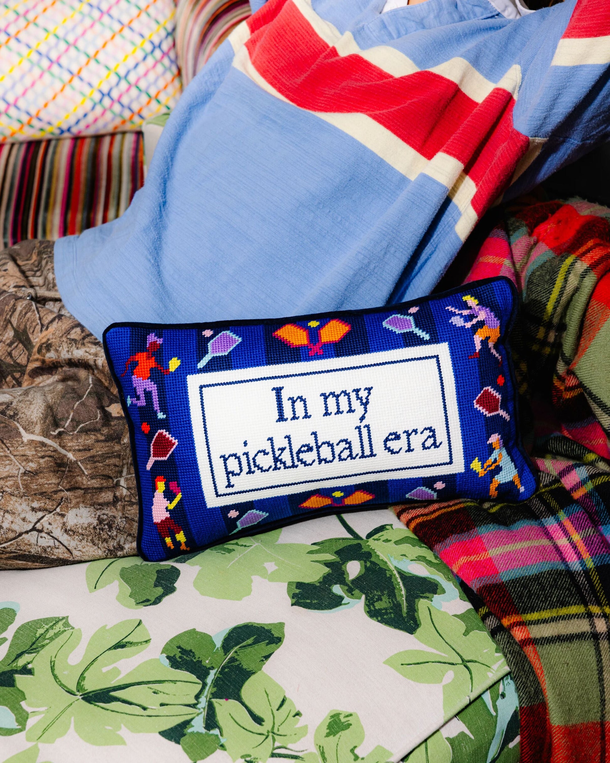 Decorative pillow with 'In my pickleball era' text on a colorful background