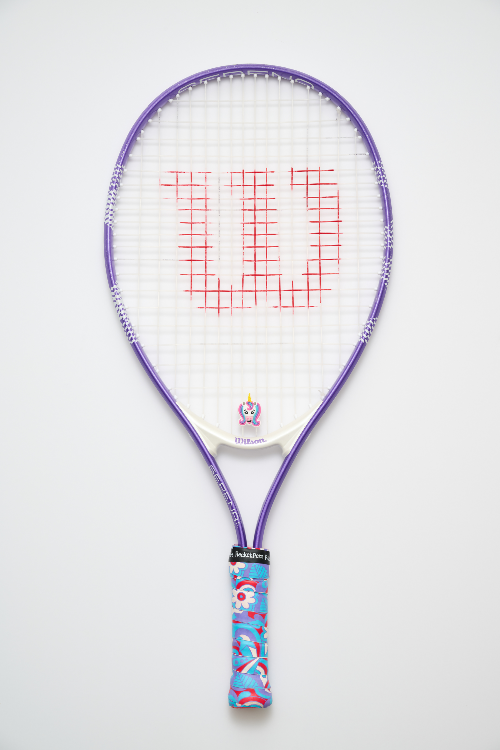 Tennis racket with a colorful handle on a white background