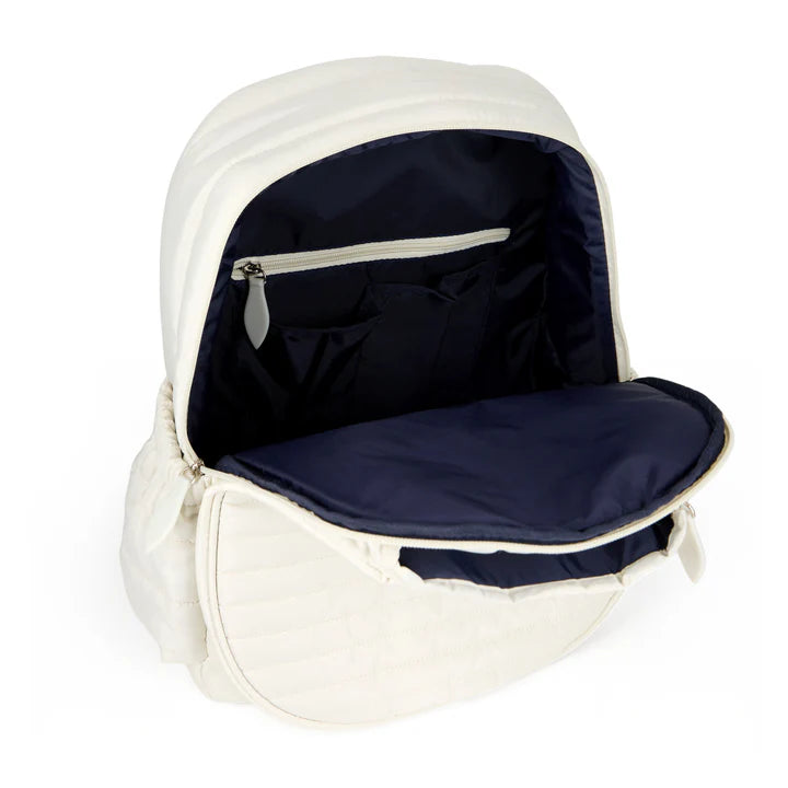 White tennis backpack with open navy interior on a white background