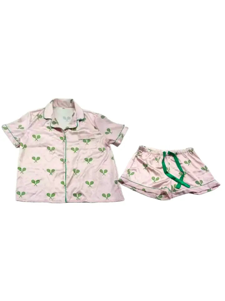 Pink satin pajamas with green tennis racquets on Tennis DuJour.