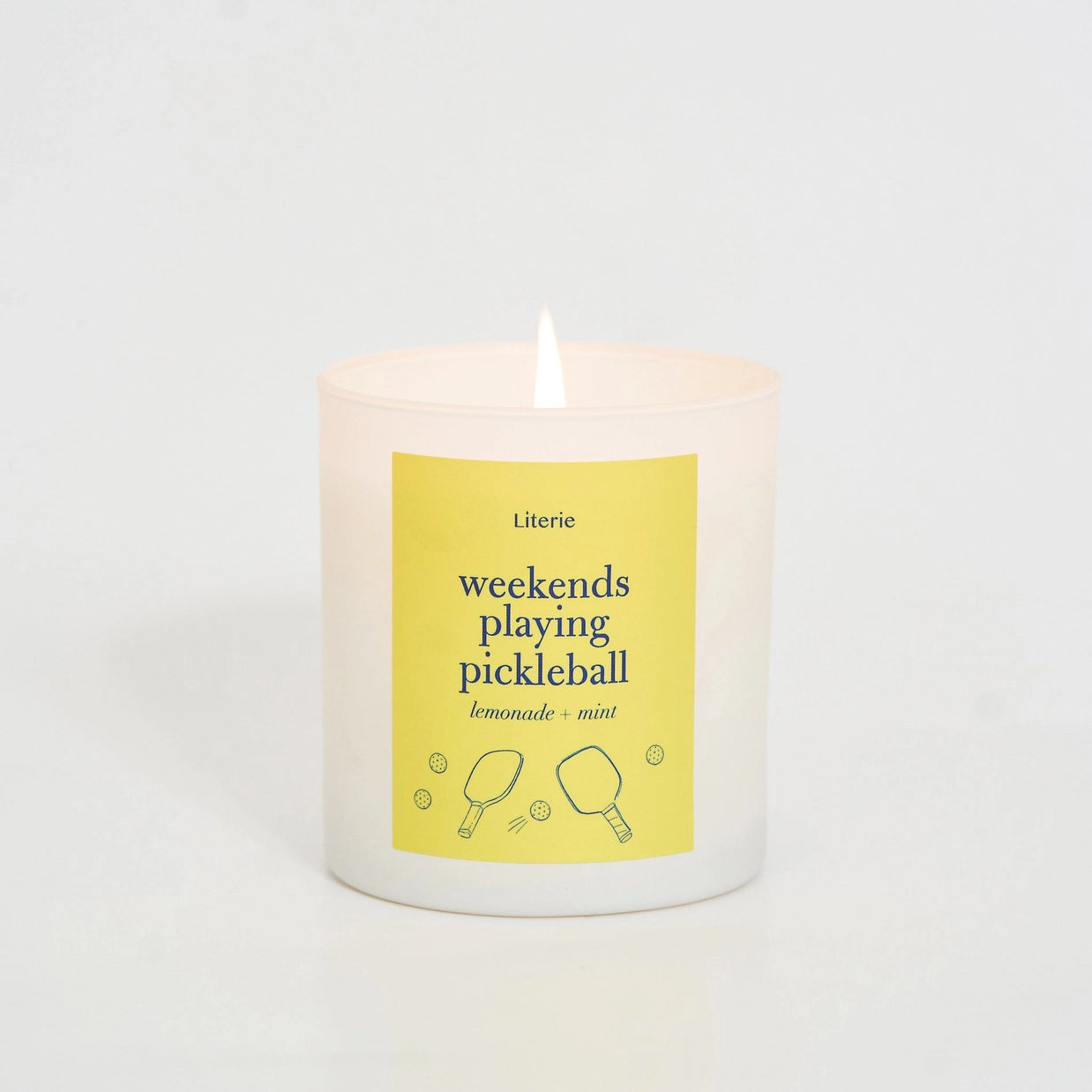 pickleball candle with a yellow label on a white background